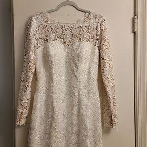 Never worn size 12 beautiful wedding gown. Tags attached.